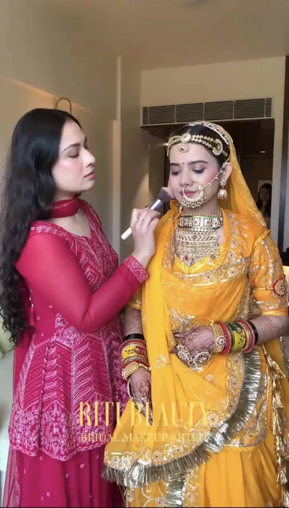 riti-neema-applying-bridal-makeup-mumbai Riti Neema applying bridal makeup to a bride in Mumbai