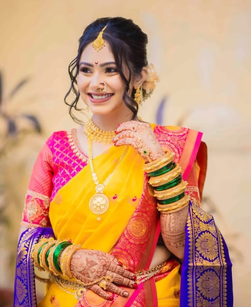 Maharashtrian bride in Nauvari saree with traditional bridal makeup by Riti Beauty Mumbai